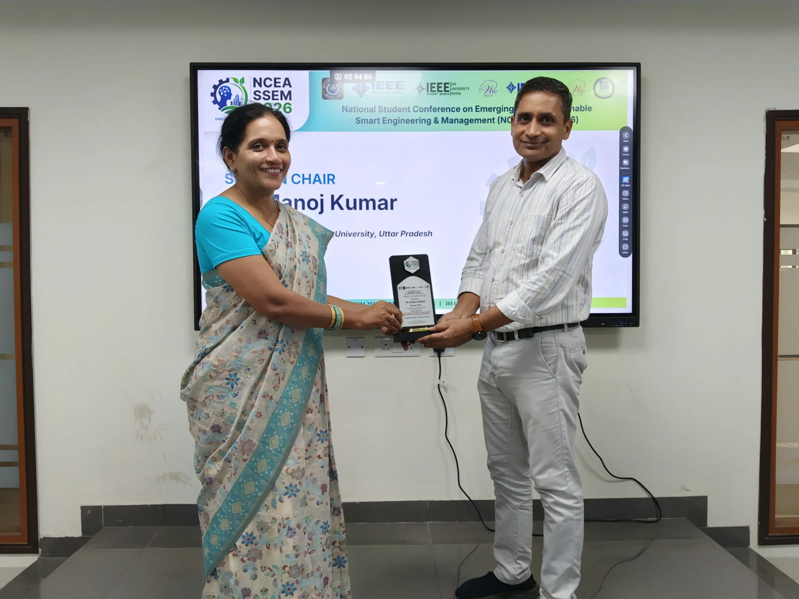 Session Chair Dr. Manoj Kumar receiving a commemorative plaque