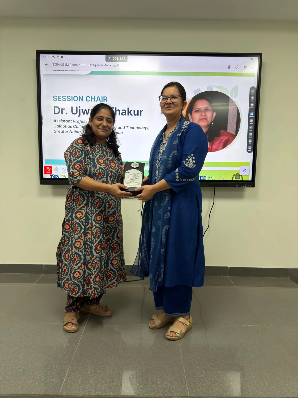 Session Chair Dr. Ujjwala Thakur receiving a commemorative plaque